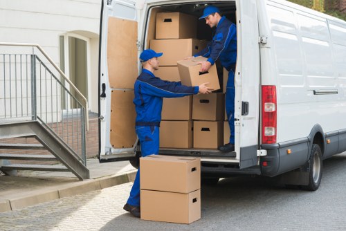 Local removals van and moving boxes in a Ruislip residential street