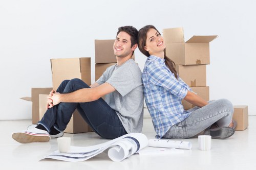 Trained movers using PPE while handling furniture carefully in Ruislip