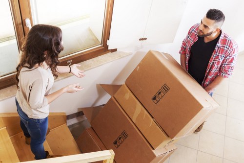 Moving team managing access and furniture in a Ruislip property